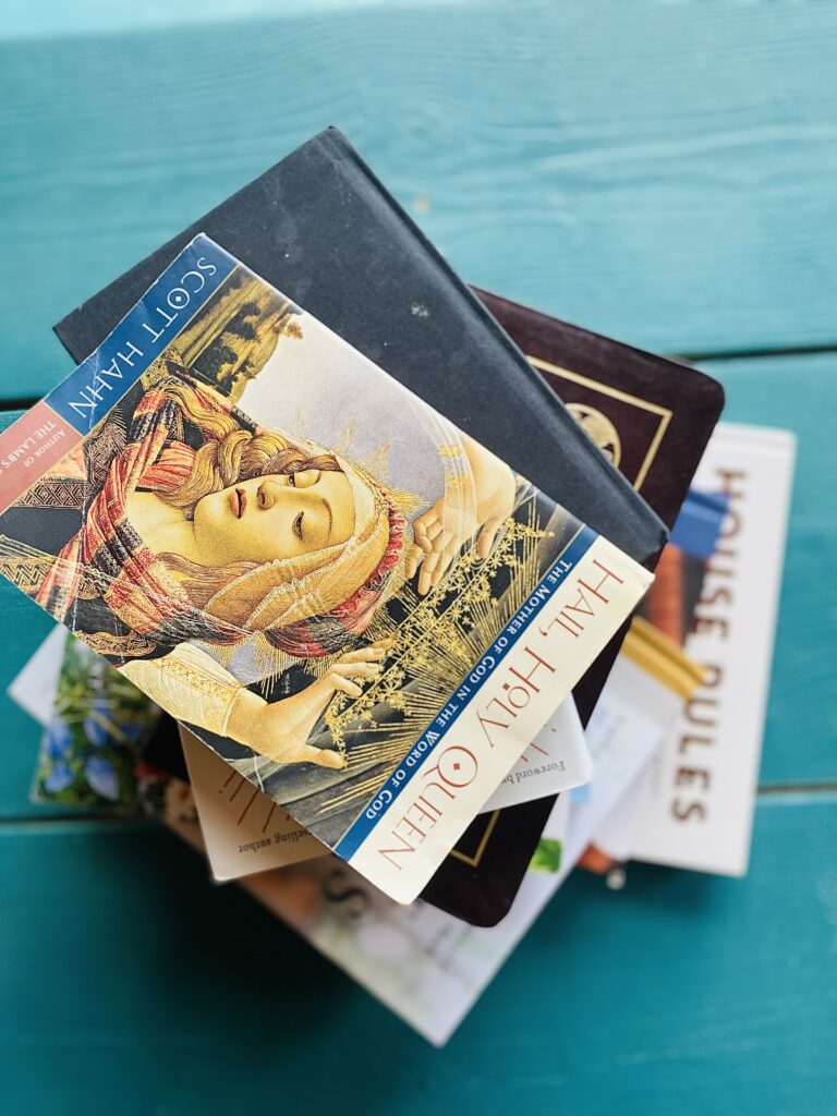 catholic books stacked on-top of each other