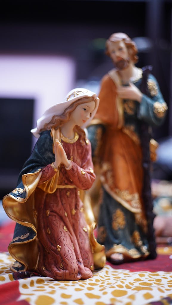 Beautifully detailed figurines of Mary and Joseph in vibrant colors, perfect for religious decor.
